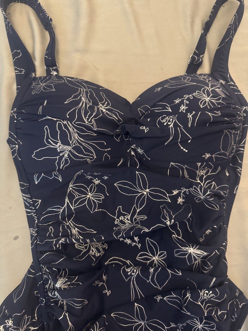 Navy Floral One-Piece Swimsuit (Category: Bikinis & Swimsuits) located in Manila. Submitted by thepixieposse (Listing ID 1464690461, Image 3). Description: Navy blue one-piece swimsuit with white line floral print all over. Sweetheart neckline with twisted detail in the front. Ruched sides for a flattering fit. Adjustable straps over the shoulders. Full coverage bottom. Clean fabric inside and out. Ready for the beach or pool. Brand new retails f