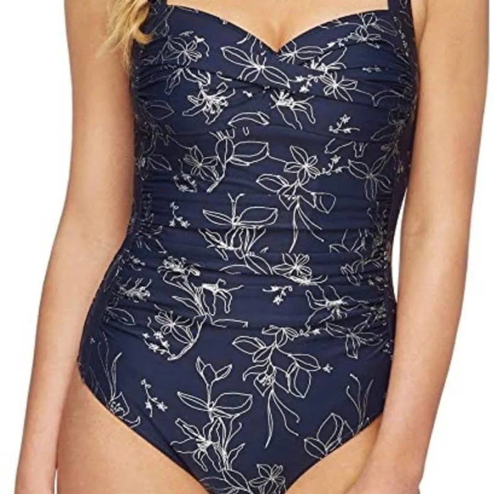 Navy Floral One-Piece Swimsuit (Category: Bikinis & Swimsuits) located in Manila. Submitted by thepixieposse (Listing ID 1464690461, Image 2). Description: Navy blue one-piece swimsuit with white line floral print all over. Sweetheart neckline with twisted detail in the front. Ruched sides for a flattering fit. Adjustable straps over the shoulders. Full coverage bottom. Clean fabric inside and out. Ready for the beach or pool. Brand new retails f