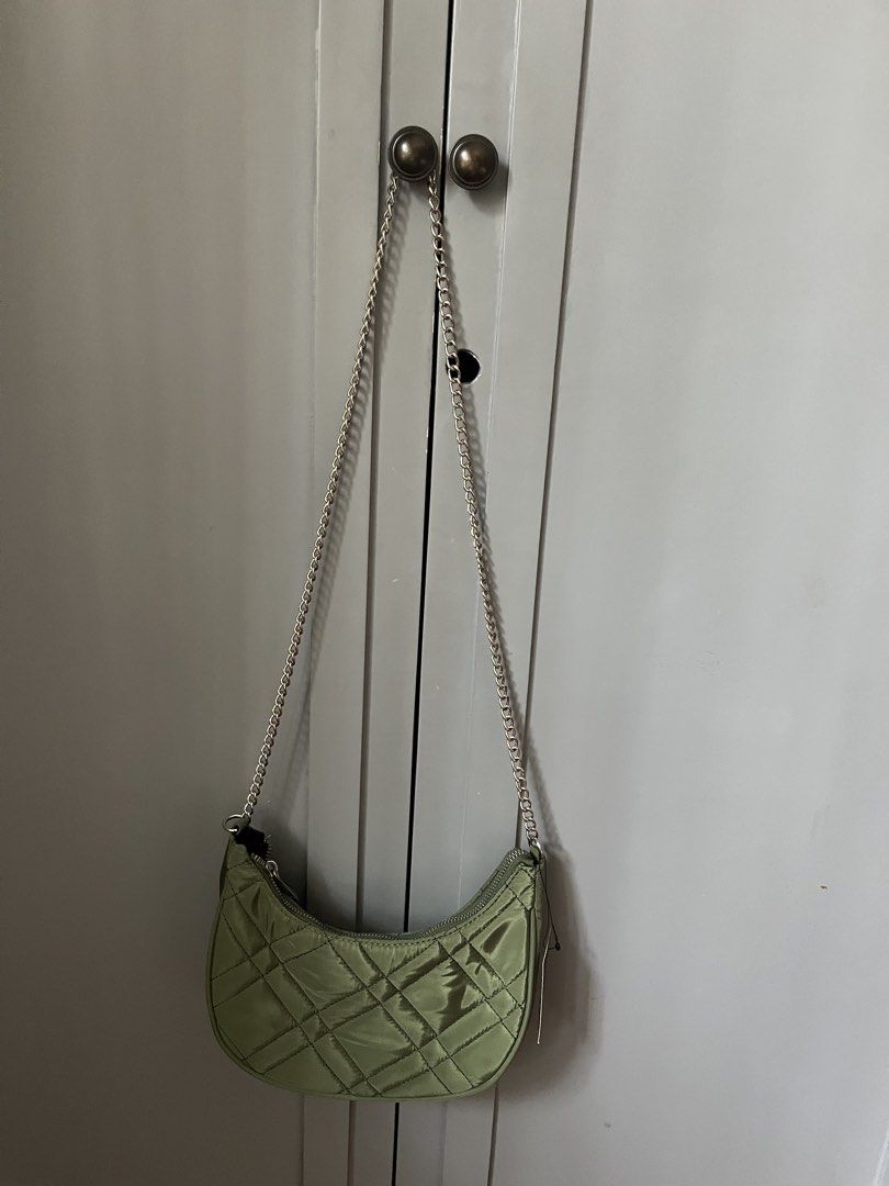 FOREVER 21 Army Green Crescent Bag w/ Silver Hardware (Category: Cross-body Bags) located in Las Pinas. Submitted by limcmc (Listing ID 1464606977, Image 1). Description: ‼️ NEVER USED. ✅ Tag/s RFS: Decluttering MOP: Gcash & BDO (NO REFUNDS) Shipping: Shouldered by the buyer (gogoexpress, j&t, lalamove) ✨ DM me for more inquiries!.