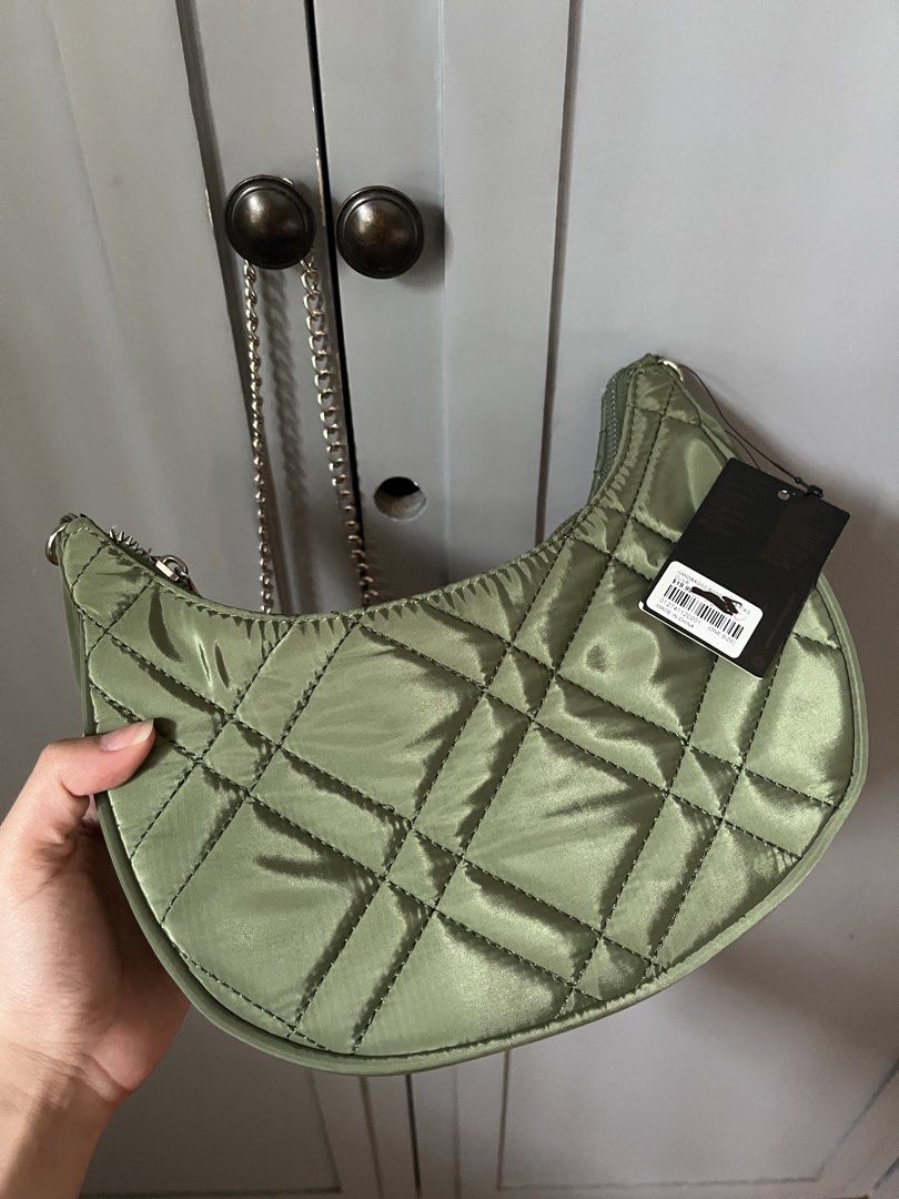 FOREVER 21 Army Green Crescent Bag w/ Silver Hardware (Category: Cross-body Bags) located in Las Pinas. Submitted by limcmc (Listing ID 1464606977, Image 2). Description: ‼️ NEVER USED. ✅ Tag/s RFS: Decluttering MOP: Gcash & BDO (NO REFUNDS) Shipping: Shouldered by the buyer (gogoexpress, j&t, lalamove) ✨ DM me for more inquiries!.