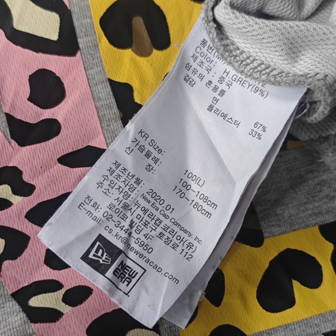 New Era T-Shirt Grey Mix Pattern Logo (Category: Tshirts & Polo Shirts ) located in Ipil. Submitted by ajthriftfinds (Listing ID 1464634681, Image 3). Description: - W: 21.5 - L: 28 - Good condition - Konting scratch sa likod ng neck and small stain need wash - Features a unique animal and camouflage print New Era logo - Tagged as 100(L) - please check measurements for accurate fit - Ideal for casual everyday wear.