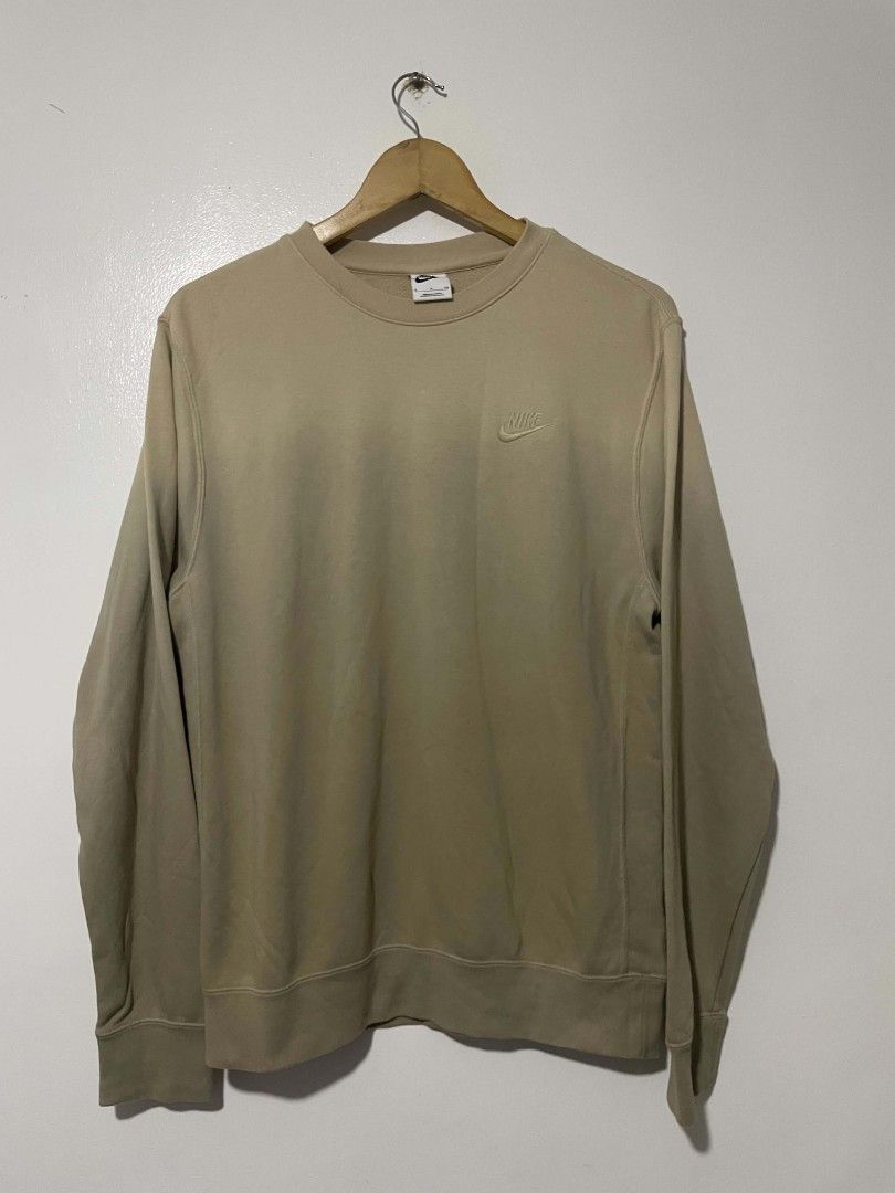 Nike Beige Crewneck Sweatshirt (Category: Coats, Jackets and Outerwear) located in Manila. Submitted by mikeee03 (Listing ID 1464692299, Image 1). Description: - Brand: Nike - Style: Crewneck sweatshirt - Color: Neutral beige / earth tone - Logo: Classic embroidered Nike swoosh on left chest - Comfort: Soft fleece interior, ribbed collar, cuffs, and hem - Fit: Standard fit, perfect for layering - Condition: Brand new / Excellent quality - Perfect