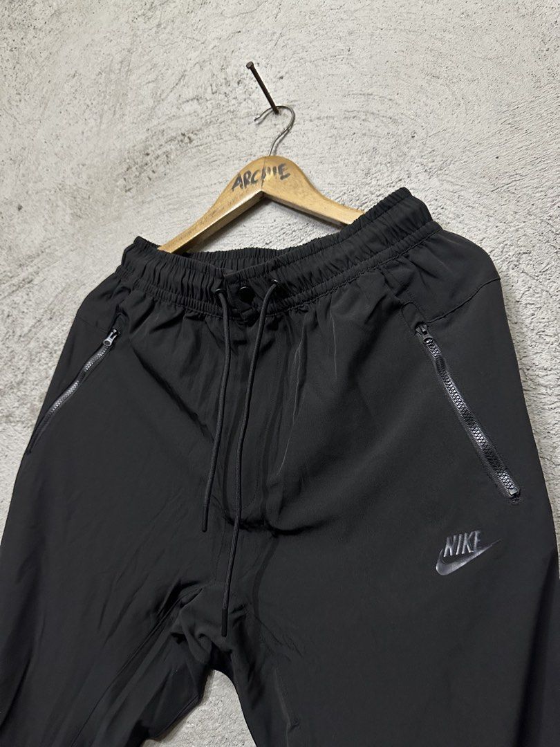 Nike Black Track Pants Joggers Size Medium / Large (Category: Joggers) located in Quezon City. Submitted by stre3tw3ar (Listing ID 1464584571, Image 2). Description: - Black Nike track pants - Size M / L - Elastic waistband with drawstring - Zippered pockets on both sides - Nike logo on the left leg - Made in China.