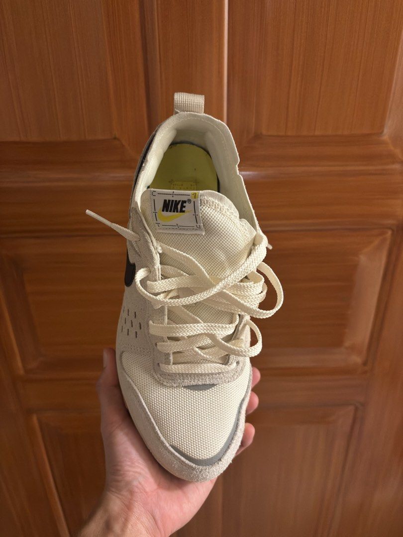 Nike C1TY Shoes Size 8.5 US (Category: Sneakers) located in Manila. Submitted by troymitra (Listing ID 1464601179, Image 2). Description: Nike C1TY sneakers in the Soft Pearl and Light Khaki colorway, highlighted by a bold black Swoosh and a vibrant yellow heel pull tab. NEGOTIABLE!! no box rfs: hindi nagagamit location: Manila Residences Tower 2, Manila.