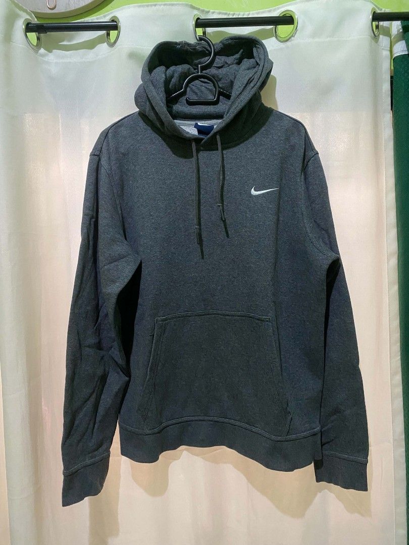 Nike Dark Grey Hoodie Size L (Category: Hoodies) located in Quezon City. Submitted by elihur.tuazon (Listing ID 1464737206, Image 3). Description: - Brand: Nike - Color: Dark Grey with white embroidered swoosh - Size: L (Blue Nike neck tag, made in China) - Features: Adjustable drawstring hood, front kangaroo pocket, ribbed cuffs and hem - Condition: Comfortable everyday pullover, perfect for cooler weather.