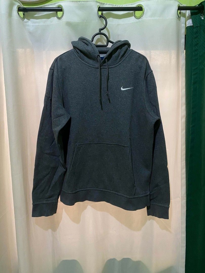 Nike Dark Grey Hoodie Size L (Category: Hoodies) located in Quezon City. Submitted by elihur.tuazon (Listing ID 1464737206, Image 2). Description: - Brand: Nike - Color: Dark Grey with white embroidered swoosh - Size: L (Blue Nike neck tag, made in China) - Features: Adjustable drawstring hood, front kangaroo pocket, ribbed cuffs and hem - Condition: Comfortable everyday pullover, perfect for cooler weather.