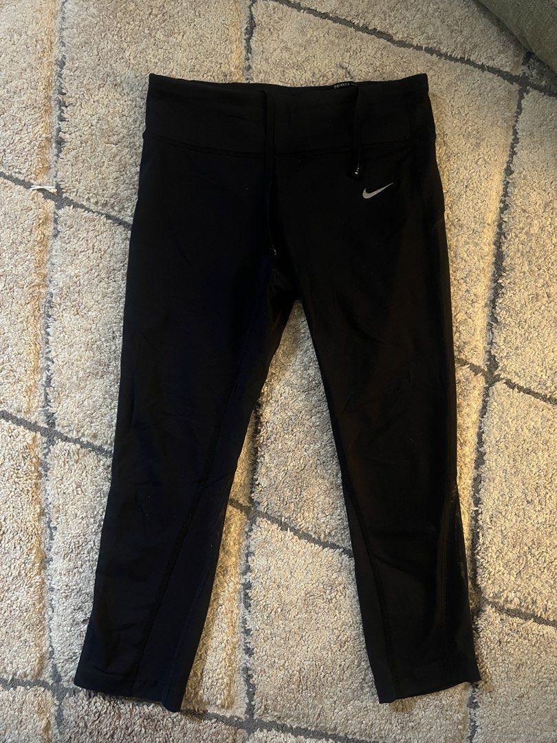 Nike Dri-Fit Black Running Capris Size M (Category: Activewear) located in Quezon. Submitted by lovdogs (Listing ID 1464622083, Image 1). Description: - Black Nike Dri-Fit running capris - Size: Medium - Features reflective dots on lower legs for enhanced visibility - Adjustable drawstring waist for a secure fit - Ideal for running, workouts, and active wear - Made in Cambodia.