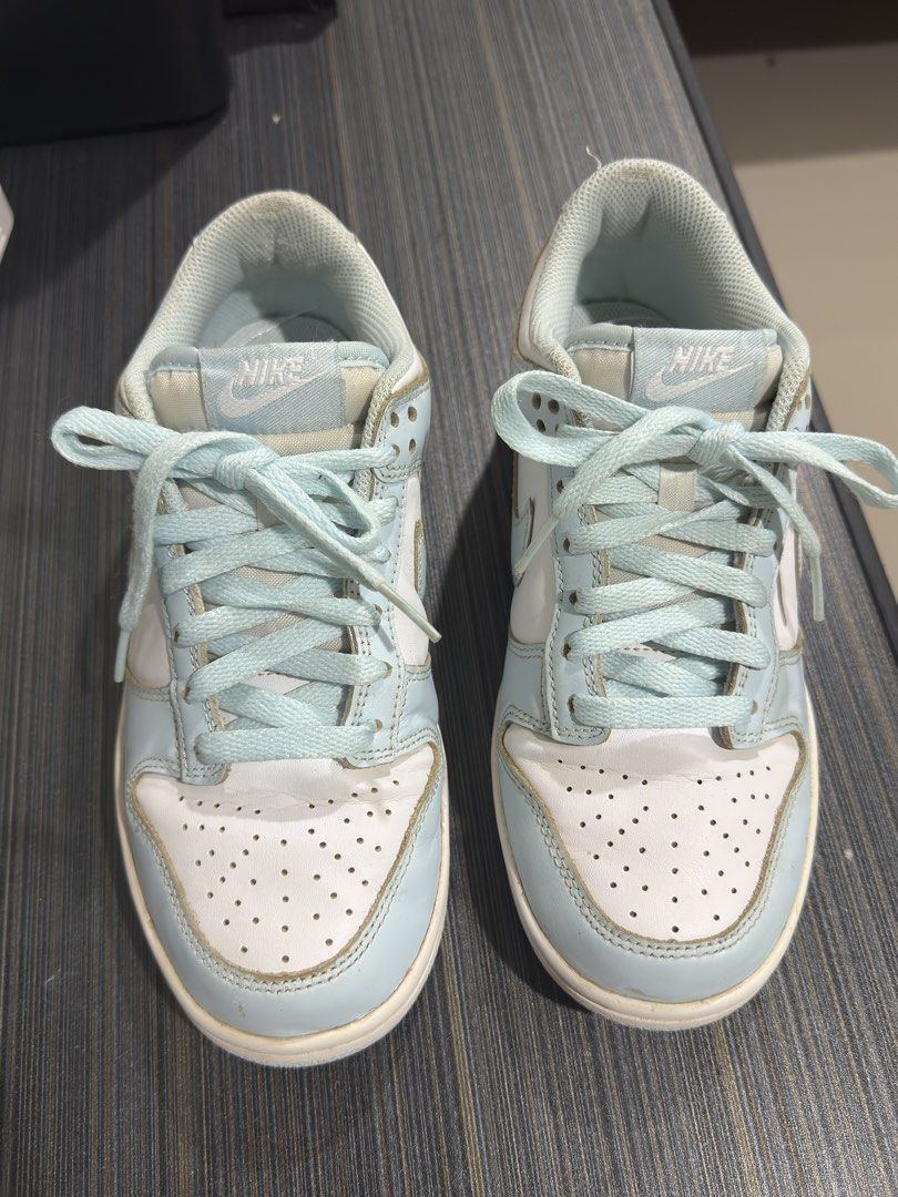 Nike Dunk Low Glacier Blue Size 6Y (Category: Babies & Kids Fashion) located in Cagayan de Oro. Submitted by tristanaceb (Listing ID 1464764172, Image 1). Description: - Model: Nike Dunk Low - Colorway: Glacier Blue and White - Size: Youth 6Y (Equivalent to Women's US 7.5) - Condition: Uppers in solid shape, soles show minor dirt from light wear - Features: Classic leather low-top design, signature swoosh, tonal light blue laces - Authenticity: S