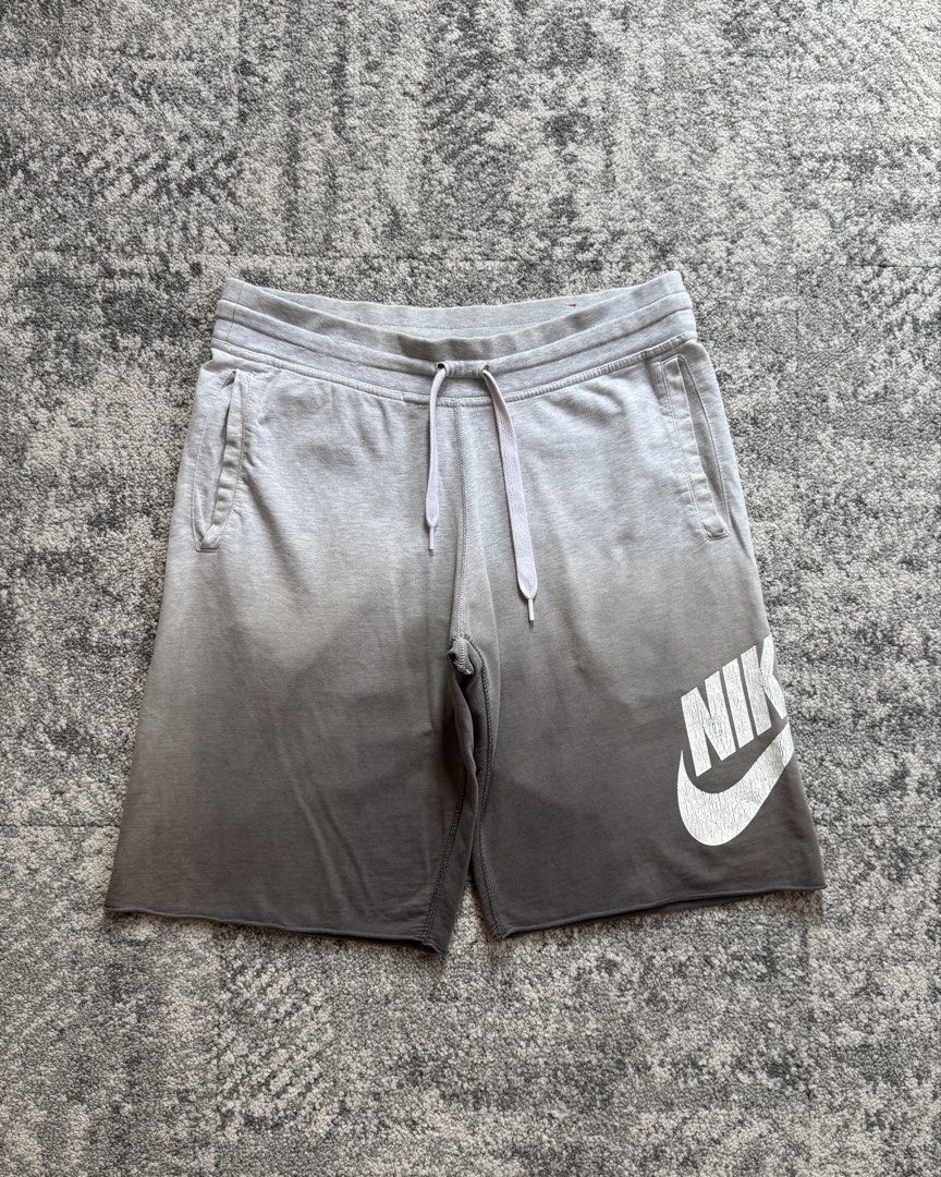 Nike Gradient Sweatshorts Grey Size M (Category: Shorts) located in Quezon City. Submitted by thrift_loots. (Listing ID 1464692843, Image 2). Description: NIKE ALUMNI SHORT Loots: ₱400 Measurements: • Waist: 34-38” • Length: 22” • Leg Opening: 12” • Condition: Good • Color Rate: 9/10 • Issue: Crack print ✔ Washed and ready to wear Please read the reminders posted on our highlights/caption before purchasing. Happy loots! 🧡.