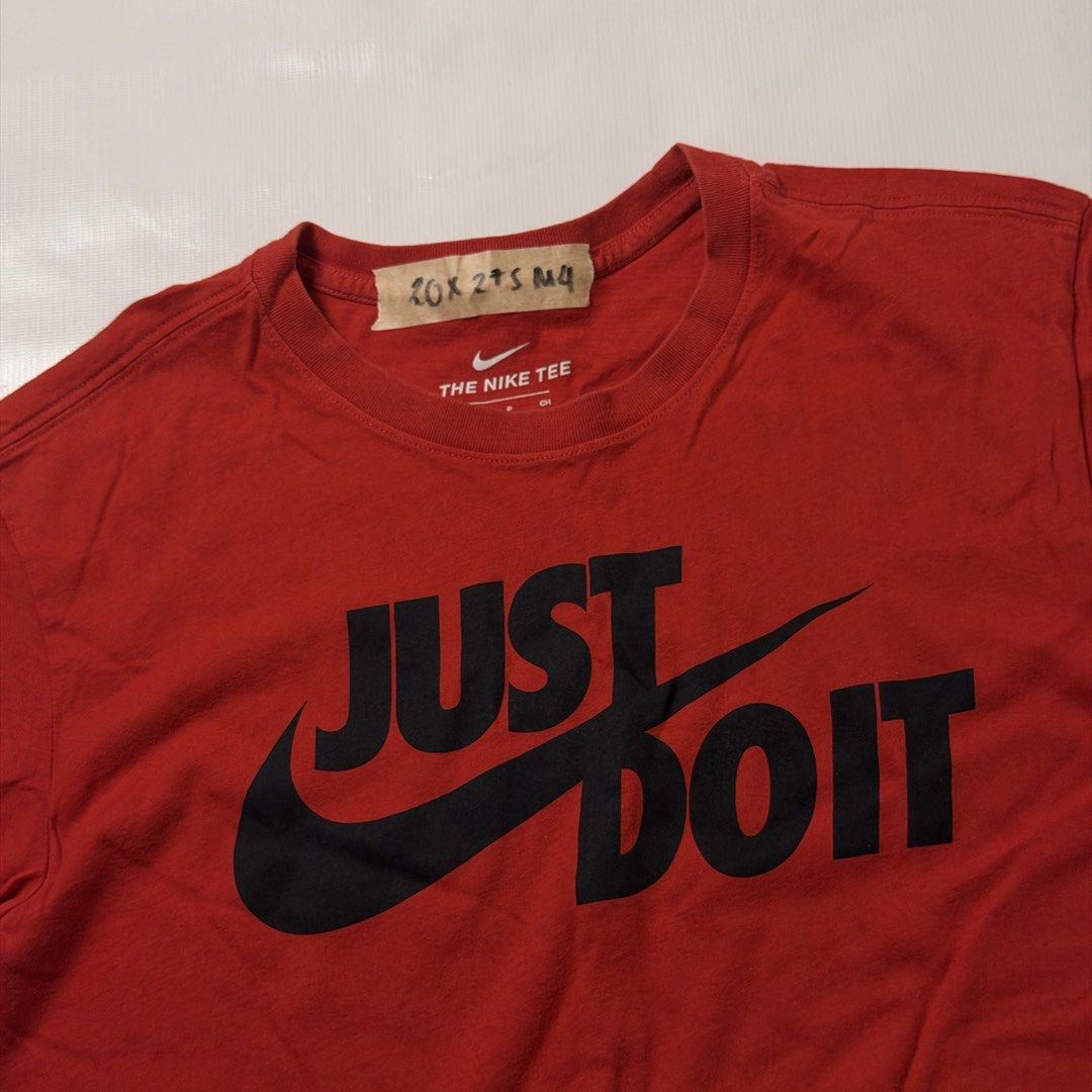 Nike Just Do It Red T-Shirt Size S (Category: Tshirts & Polo Shirts ) located in Manila. Submitted by johnedel_james (Listing ID 1464686644, Image 2). Description: - Red Nike 'Just Do It' T-shirt - Size: S (Made in Vietnam) - Material: 100% Cotton - Perfect for casual everyday wear - Features a small handwritten tag on the collar area - Please check photos for detailed condition.
