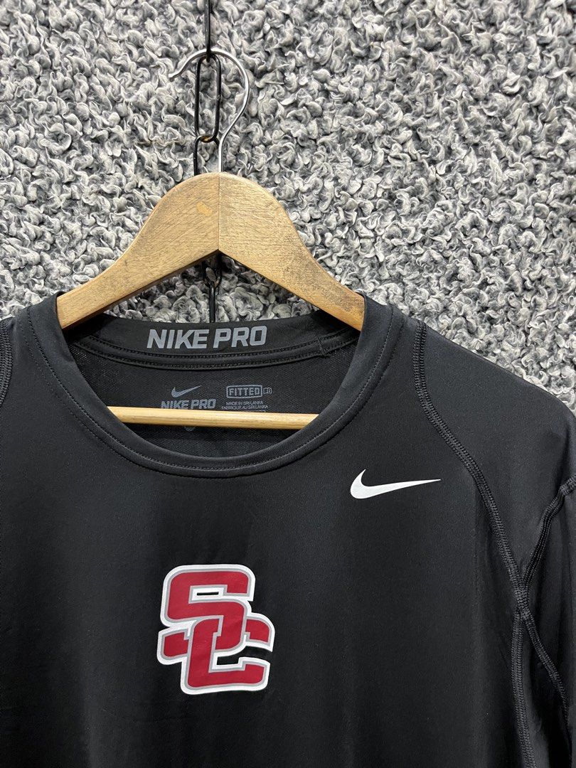 Nike Pro athletic t-shirt | Size XL (Category: Tshirts & Polo Shirts ) located in General Trias. Submitted by zrchustle.604 (Listing ID 1464626666, Image 2). Description: Nike Pro athletic t-shirt featuring the distinctive red and white interlock USC Trojans logo centered on the chest..