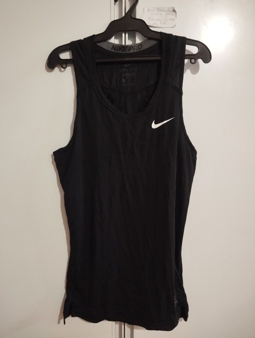Nike Pro Dri-FIT Black Training Tank Top (Category: Activewear) located in Candon. Submitted by bernabepradoiii (Listing ID 1464580252, Image 1). Description: - Black Nike Pro Dri-FIT tank top - Ideal for workouts, training, gym, and running - Made with breathable fabric for maximum coolness - Iconic Nike swoosh logo - Comfortable fit for all active days.