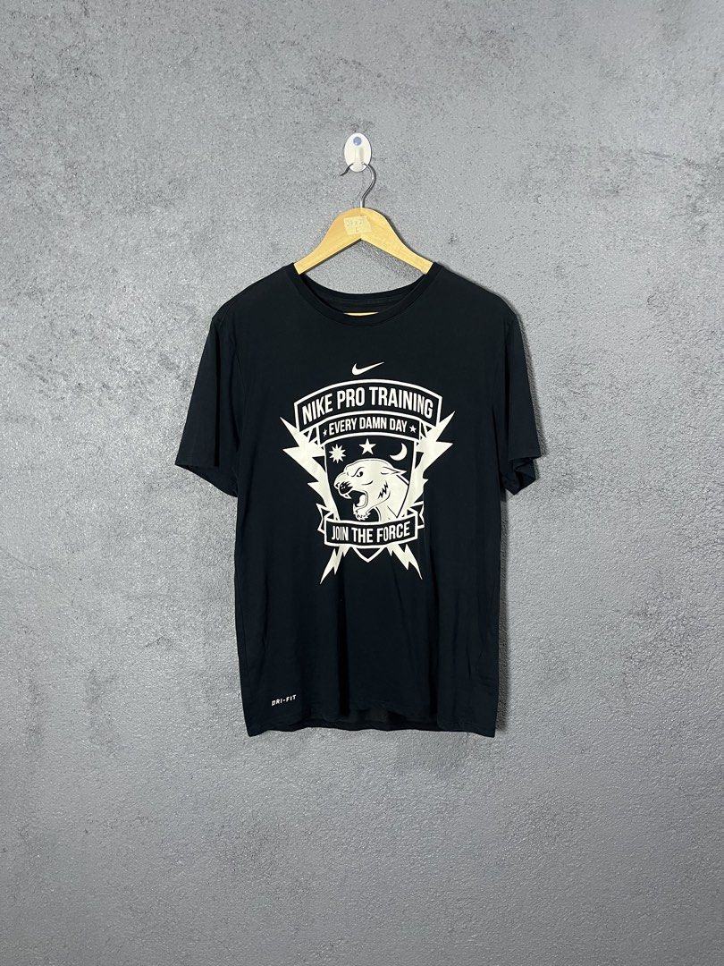 Nike Pro Training Join The Force T-Shirt Black Large (Category: Activewear) located in Famy. Submitted by basicthrifted (Listing ID 1464704555, Image 1). Description: - Brand: Nike Pro - Size: Large (Athletic cut) - Color: Black - Material: Dri-Fit technology fabric for sweat-wicking comfort - Design: Bold front panther graphic with 'Every Damn Day' and 'Join The Force' lettering - Condition: Good, with inner collar tag and lower care tags attach