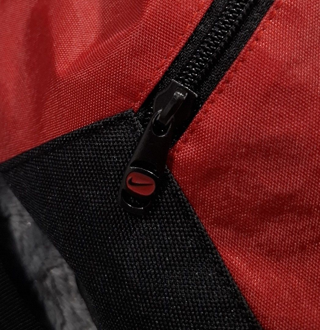 Nike Red Black Drawstring Gym Bag Backpack (Category: Backpacks) located in Sorsogon. Submitted by johnmichae69459 (Listing ID 1464641539, Image 3). Description: - Red and black Nike drawstring bag - Front zip pocket for secure storage - Main compartment with easy drawstring closure - 16 width - 18 lenght - Durable nylon and polyester material - Ideal for gym essentials, daily items, sports, or casual outings.