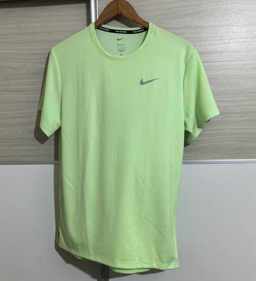 Nike Running Dri-FIT Neon Green Tee (Category: Activewear) located in Meycauayan. Submitted by preloved_items_j (Listing ID 1464738459, Image 1). Description: Width 19 inches Length 25 inches Used only once.