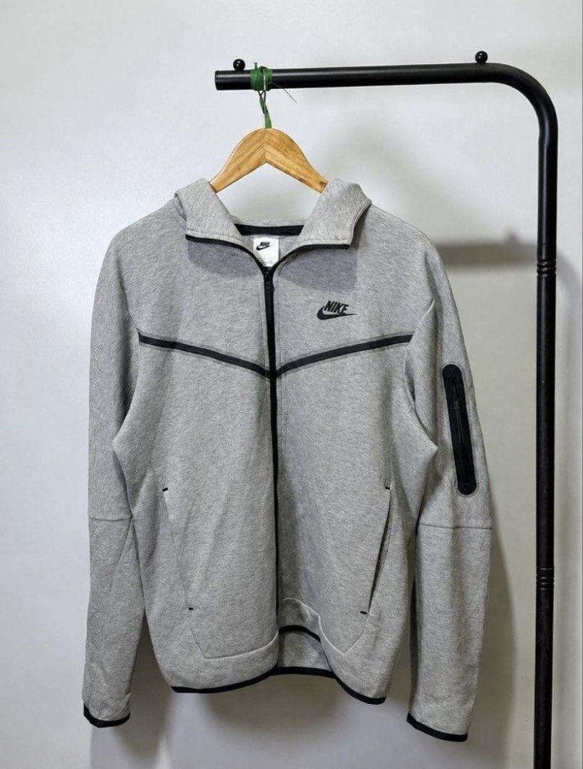 Nike Tech Fleece Hoodie-Grey (Category: Coats, Jackets and Outerwear) located in Manila. Submitted by j.thrift.store1 (Listing ID 1464613899, Image 1). Description: Very Excellent Condition Issue:scratches sa hood(see last pic) Length:26.5 Width:22.