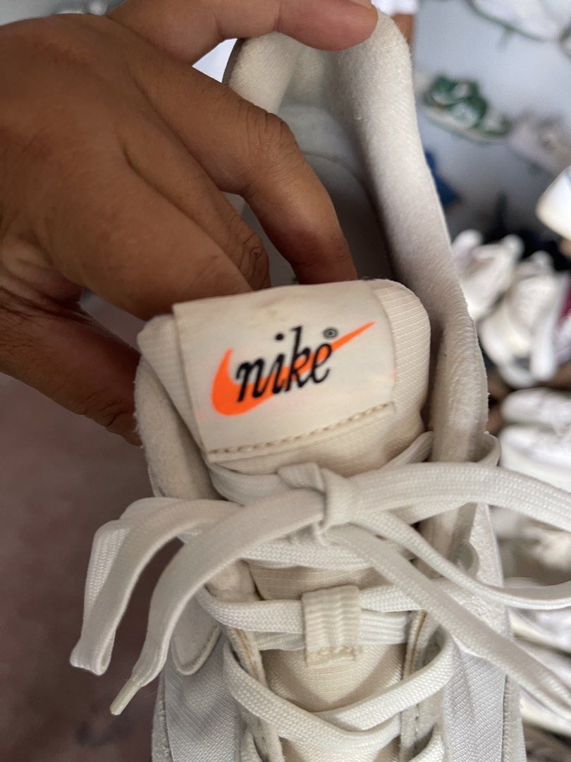 Nike White Orange Retro Style Sneakers (Category: Sneakers) located in Toledo. Submitted by klnmia (Listing ID 1464629624, Image 2). Description: - Retro white Nike sneakers - Features striking orange accents - Classic lace-up closure - Durable thick rubber sole with tan and black detailing - Perfect for everyday casual wear.