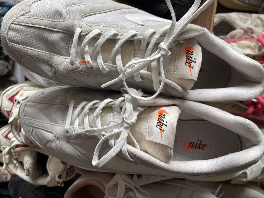 Nike White Orange Retro Style Sneakers (Category: Sneakers) located in Toledo. Submitted by klnmia (Listing ID 1464629624, Image 1). Description: - Retro white Nike sneakers - Features striking orange accents - Classic lace-up closure - Durable thick rubber sole with tan and black detailing - Perfect for everyday casual wear.