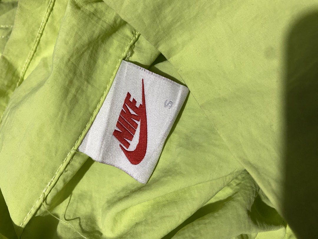 Nike x Stussy Windbreaker Jacket Lime Green (Category: Coats, Jackets and Outerwear) located in Baguio. Submitted by pickemup2600 (Listing ID 1464714858, Image 3). Description: - Brand: Nike x Stüssy - Item: Lightweight nylon windbreaker - Color: Vibrant lime green - Size: Small (Tag intact) best fit medium to large - Details: Half-zip closure, high collar, elasticated cuffs and hem - Branding: White Nike Swoosh on front, large Stüssy graffiti lo