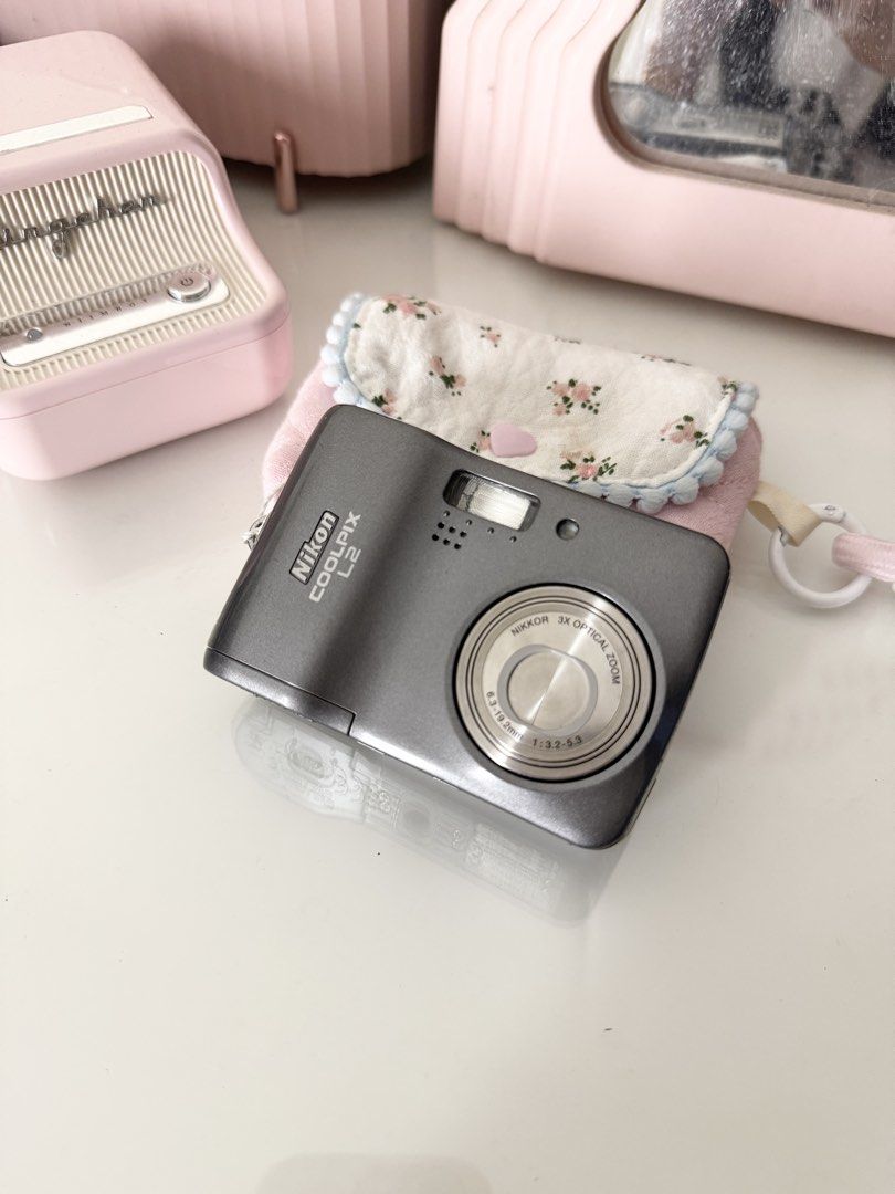 Nikon Coolpix L2 Gray Digital Camera Digicam (Category: Cameras) located in Marilao. Submitted by toutlemonde (Listing ID 1464751391, Image 1). Description: - 6MP CCD sensor - 3x optical zoom - can take photos/ videos - 9/10 cosmetic condition - uses SD card (not included) - uses double A battery (not included) Issue: no functional issue Inclusions: pouch, troubleshoot card Location: Marilao, Bulacan MOD: J&T / LBC / Meetup (+₱250hf SM north/ tri