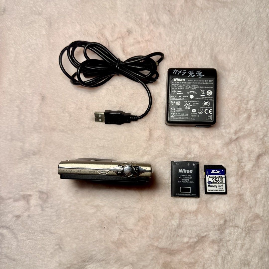 Nikon COOLPIX S4000 Digital Camera with Accessories (Category: Cameras) located in Manila. Submitted by kyliehilario (Listing ID 1464601950, Image 3). Description: ⋆˚࿔ Nikon COOLPIX S4000 𝜗𝜚˚⋆ 📸 ₱7,499 ૮꒰˵• ﻌ •˵꒱ა features ✿ 12.0 MP CCD sensor ✿ NIKKOR 4× optical zoom lens (27–108mm equivalent) ✿ Electronic Vibration Reduction (VR) ✿ 3.0″ touchscreen LCD (460k dots) ✿ HD 720p video recording ✿ EXPEED C2 image processor ✿ Face-priority autofocu