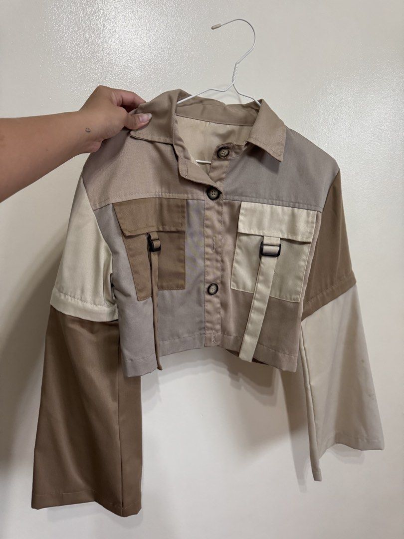 Nin & Yang Patchwork Cropped Jacket with Zippers (Category: Coats, Jackets and Outerwear) located in Mandaluyong City. Submitted by missnaldo (Listing ID 1464661160, Image 1). Description: - Patchwork cropped jacket - From Nin & Yang’s first few releases - Earthy tones, very versatile - Functional pockets with buckle details - Zippered sleeves for versatile design mix - Local Philippine brand.