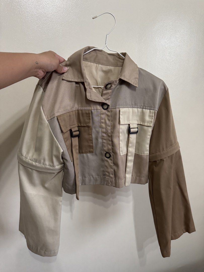Nin & Yang Patchwork Cropped Jacket with Zippers (Category: Coats, Jackets and Outerwear) located in Mandaluyong City. Submitted by missnaldo (Listing ID 1464661160, Image 3). Description: - Patchwork cropped jacket - From Nin & Yang’s first few releases - Earthy tones, very versatile - Functional pockets with buckle details - Zippered sleeves for versatile design mix - Local Philippine brand.