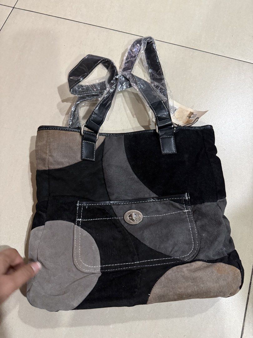 Nine west (Category: Tote Bags) located in Manila. Submitted by metrosen (Listing ID 1464584506, Image 1). Description: - Stylish patchwork tote bag - Made with corduroy and faux leather accents - Front pocket with secure twist lock closure - Durable black faux leather straps - Brand new with original tags attached - Ample space for all your essentials.