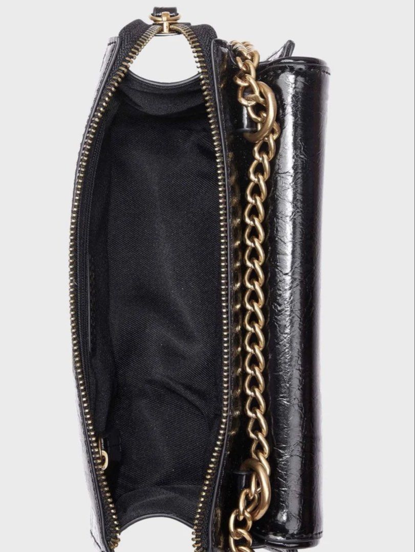 Nine West Black Chain Shoulder Bag (Category: Shoulder Bags) located in Manila. Submitted by francine.edit (Listing ID 1464673485, Image 3). Description: Description: Selling my pre-loved Nine West chain detailed crossbody bag in classic black. Super chic and versatile piece that transitions easily from day to night! Brand: Nine West Color / Hardware: Black with gold chain details and front logo plate Condition: Good pre-loved condition (clean in
