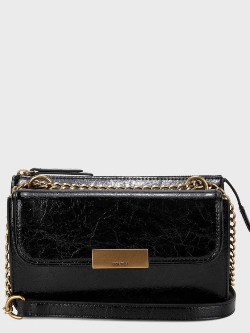 Nine West Black Chain Shoulder Bag (Category: Shoulder Bags) located in Manila. Submitted by francine.edit (Listing ID 1464673485, Image 2). Description: Description: Selling my pre-loved Nine West chain detailed crossbody bag in classic black. Super chic and versatile piece that transitions easily from day to night! Brand: Nine West Color / Hardware: Black with gold chain details and front logo plate Condition: Good pre-loved condition (clean in