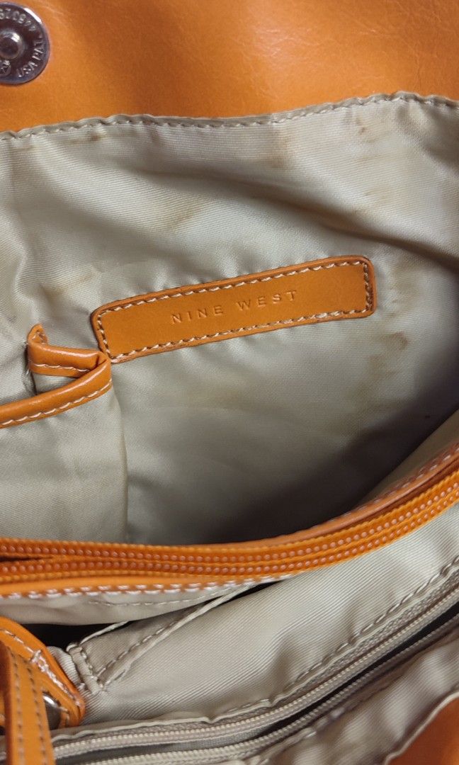 Nine West Orange Shoulder Bag Office School Bag (Category: Shoulder Bags) located in Pasig City. Submitted by xcess_baggage (Listing ID 1464598047, Image 2). Description: bag charm not included.. name tag ko po yang nakasabit. 😁.