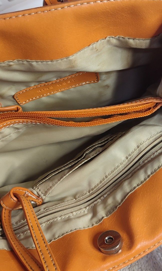 Nine West Orange Shoulder Bag Office School Bag (Category: Shoulder Bags) located in Pasig City. Submitted by xcess_baggage (Listing ID 1464598047, Image 3). Description: bag charm not included.. name tag ko po yang nakasabit. 😁.