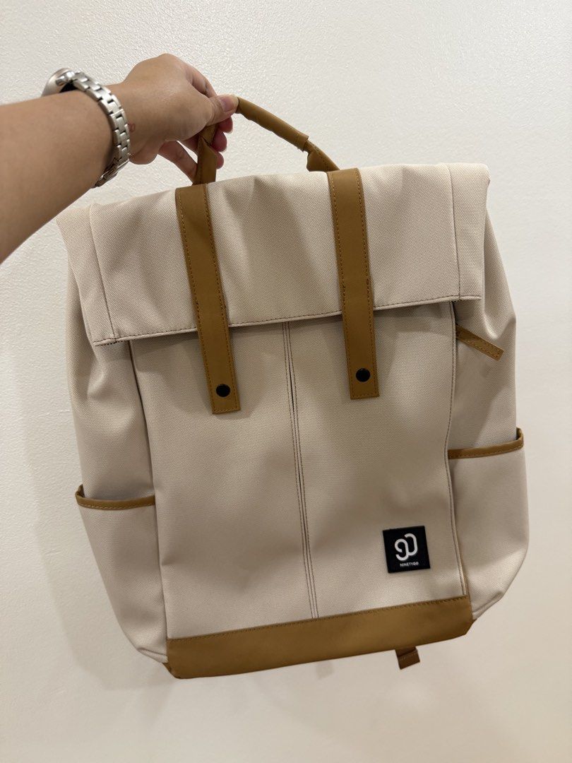 NINETYGO Beige Canvas Backpack with Brown Leather Accents (Category: Backpacks) located in Paranaque City. Submitted by majamili (Listing ID 1464676437, Image 1). Description: Unsealed but never been used! Got this as a gift pero never ko talaga nagamit, naka tago lang. SRP: ₱1,990 Material: Fabric IP Rating: Anti-splash Dimension: 440 x 300 x 150 mm 700g Special Features: Large capacity with multiple compartments and pockets for all-day use Fits