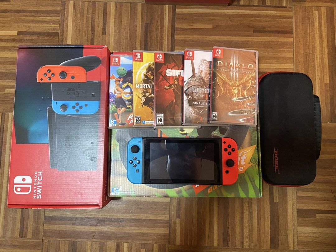 Nintendo Switch Console with Games and Accessories (Category: Nintendo) located in Quezon City. Submitted by miamiheat03 (Listing ID 1464576629, Image 1). Description: Selling as a bundle (slightly negotiable) Nintendo Switch 1 version 2 and RingFit Adventure Includes: SD card (128gb) Screen Protector (already installed) Black/red case All original accessories and box - dock - charger - hdmi cable - controller holder - X2 wrist joy-con strap Ring
