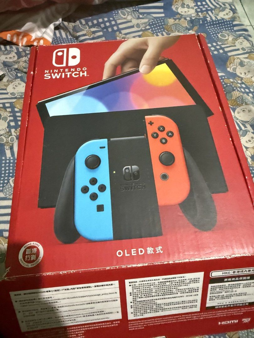 Nintendo Switch OLED Model Console with Neon Red/Blue Joy-Cons (Category: Nintendo) located in Manila. Submitted by jrroque (Listing ID 1464674626, Image 3). Description: - Nintendo Switch OLED Model - Neon Red and Blue Joy-Cons included - Comes with dock and all necessary cables - Original box included - Ready for gaming at home or on the go - Feel free to ask any questions! - comes with two games nba and super mario deluxe - comes with 128 gb m