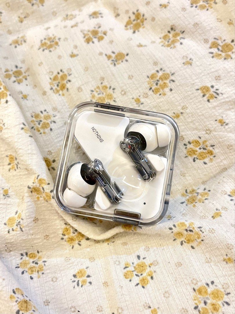 Nothing Ear (1) Wireless Earbuds (Category: Earphones) located in Bacolod City. Submitted by vintage_vogue6100 (Listing ID 1464697526, Image 2). Description: - Model: Nothing Ear (1) Wireless Earbuds - model number : B171 - Color: White with unique transparent design on stems and case - Condition: Clean, well-maintained, and ready to use - Features: Great sound quality and active noise cancellation (ANC) - Inclusions: Original packaging box and c