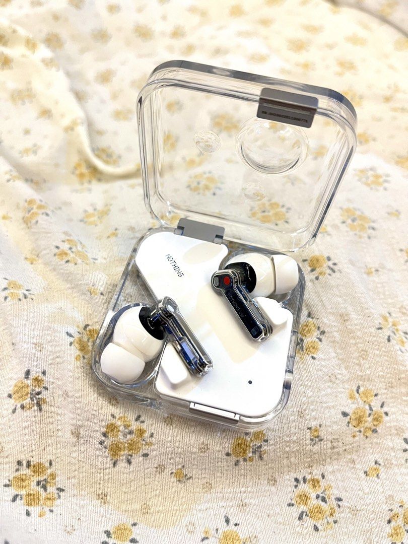 Nothing Ear (1) Wireless Earbuds (Category: Earphones) located in Bacolod City. Submitted by vintage_vogue6100 (Listing ID 1464697526, Image 3). Description: - Model: Nothing Ear (1) Wireless Earbuds - model number : B171 - Color: White with unique transparent design on stems and case - Condition: Clean, well-maintained, and ready to use - Features: Great sound quality and active noise cancellation (ANC) - Inclusions: Original packaging box and c