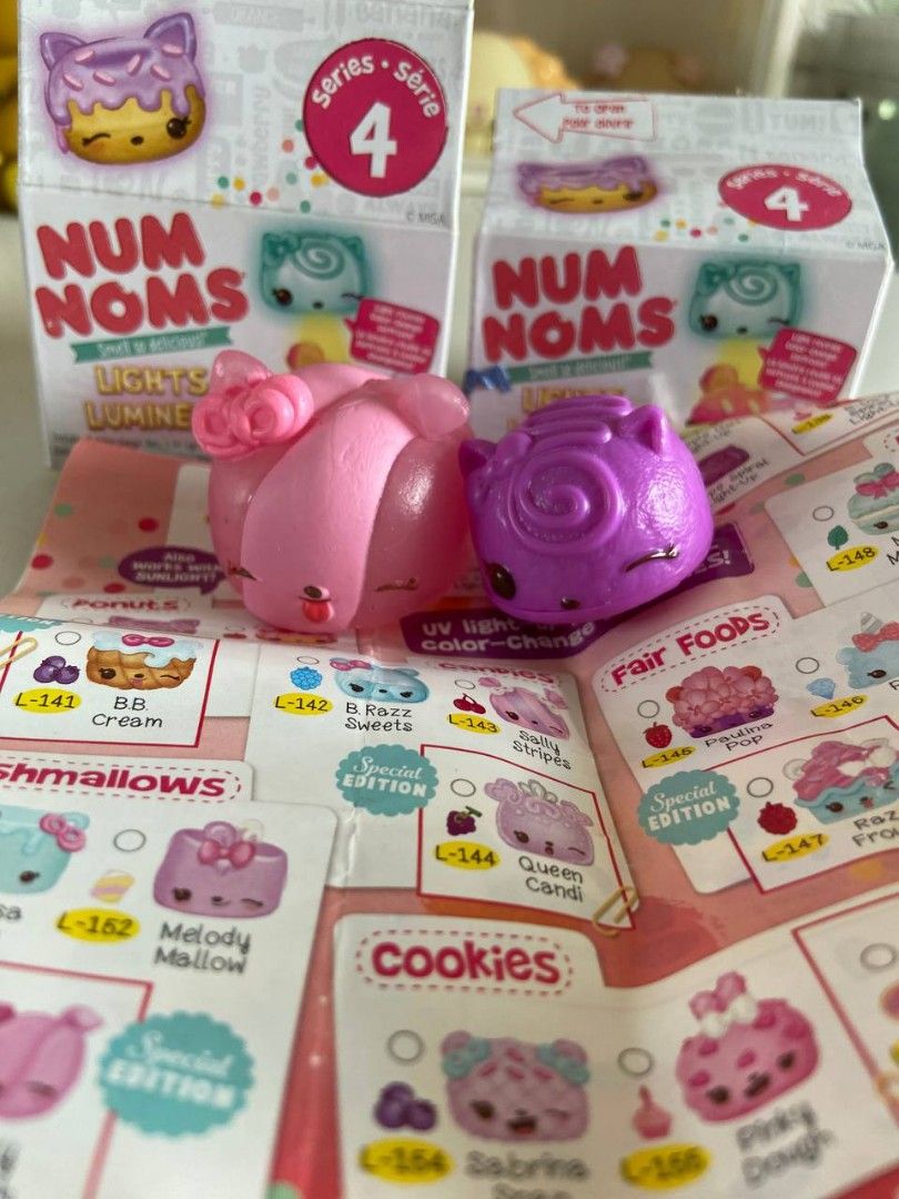 Num Noms (Category: Designer & Blind Box Toys) located in Manila. Submitted by mezz0piano (Listing ID 1464603092, Image 1). Description: 210 for both, 200 if payo • Opened but complete • DISCLAIMER: UV light (purple nom) is either non-functional or too weak na MOP: Gcash| MOD: Lalamove / J&T 📌 Makati.