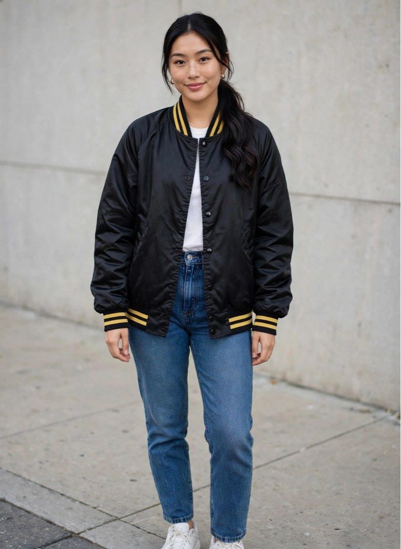 Nylon Bomber Jacket Black Yellow (Category: Coats, Jackets and Outerwear) located in San Pedro. Submitted by lifebeginsaftercoff33 (Listing ID 1464582203, Image 2). Description: - Classic black bomber jacket - Size: L (US) on tag - Dimes: 24-25 x 25 in - Can be unisex - Yellow striped collar and cuffs - 100% nylon shell - Acetate and nylon lining - Snap button closure - Two front pockets - Great for layering - Very soft comfy light fabric - Made 