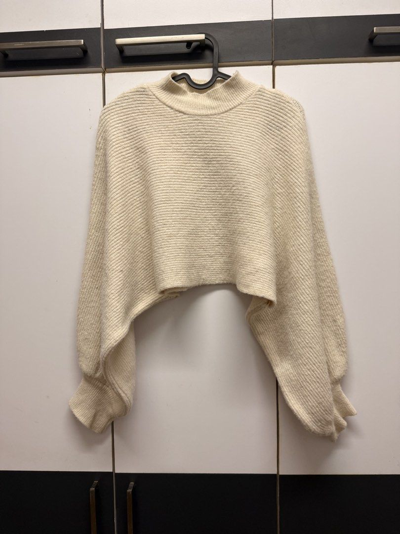 Off white bat wing knitted cropped poncho (Category: Coats, Jackets and Outerwear) located in Quezon City. Submitted by mine4now (Listing ID 1464644160, Image 1). Description: What: Off white bat wing knitted cropped poncho Origin: online bought Condition: perfect like new condition. Perfect for staying indoor during winter or cold weather. Classy vibe and fashionable too. Size: Xs - medium RFS: DECLUTTERING Shipping fee: PAID by the buyer No: CO
