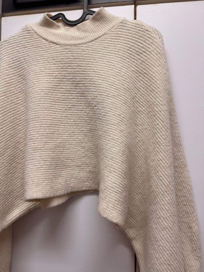 Off white bat wing knitted cropped poncho (Category: Coats, Jackets and Outerwear) located in Quezon City. Submitted by mine4now (Listing ID 1464644160, Image 2). Description: What: Off white bat wing knitted cropped poncho Origin: online bought Condition: perfect like new condition. Perfect for staying indoor during winter or cold weather. Classy vibe and fashionable too. Size: Xs - medium RFS: DECLUTTERING Shipping fee: PAID by the buyer No: CO