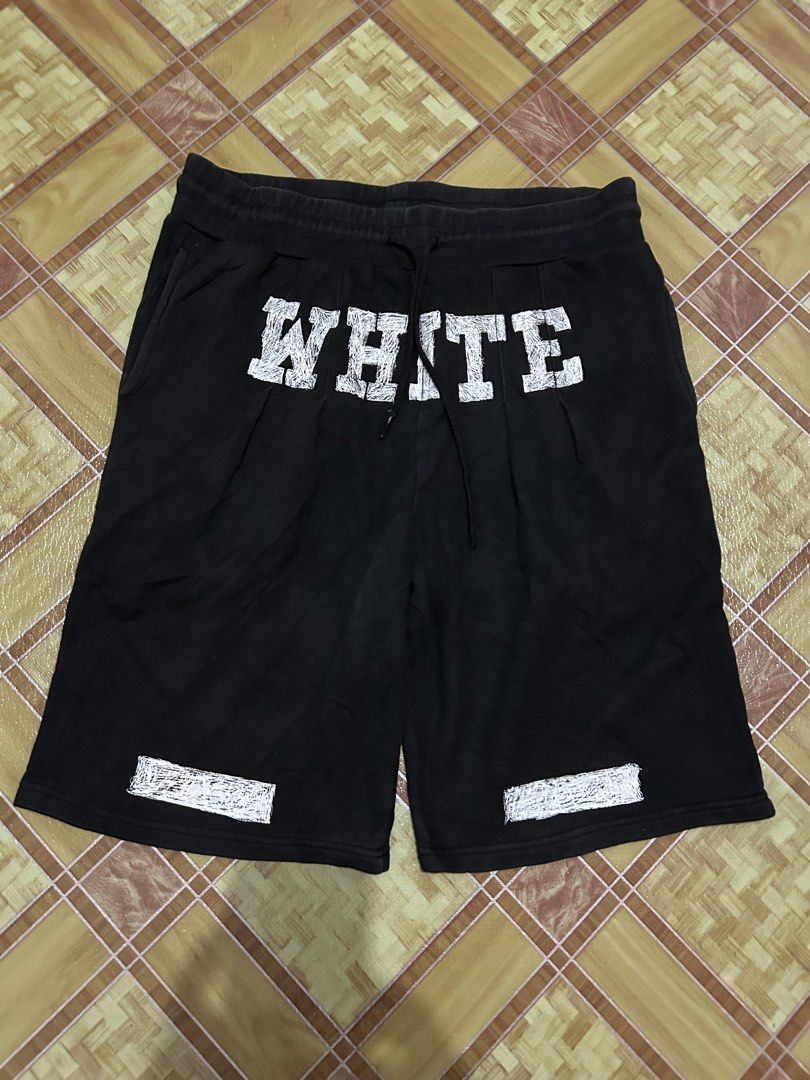 Off-White Black Diagonal Striped Sweatshorts (Category: Shorts) located in Manila. Submitted by livedog-d301 (Listing ID 1464734786, Image 1). Description: - Brand: Off-White - Color: Black with white distressed text and iconic diagonal stripes - Material: Comfortable cotton fleece - Features: Drawstring waistband, two side pockets, and interior wash tags intact - Condition: Excellent, ready to wear - Perfect for daily streetwear and casual styli