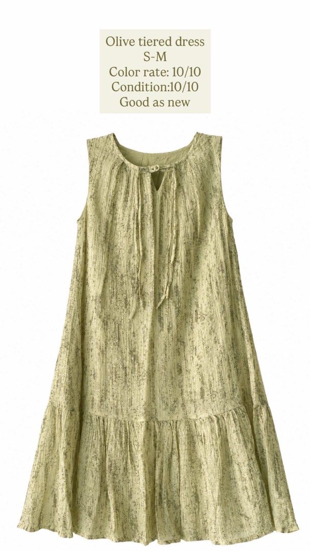 Olive tiered sleeveless dress (Category: Dresses) located in Iloilo. Submitted by getnagetch (Listing ID 1464702257, Image 1). Description: - Color & Pattern: Olive green with a subtle pattern - Fit & Size: Flowy fit, fits Size S to M - Design: Sleeveless, V-neckline with top tie strings - Condition: Worn once, washed, and ready to wear - Perfect for: Warm days and casual outings.