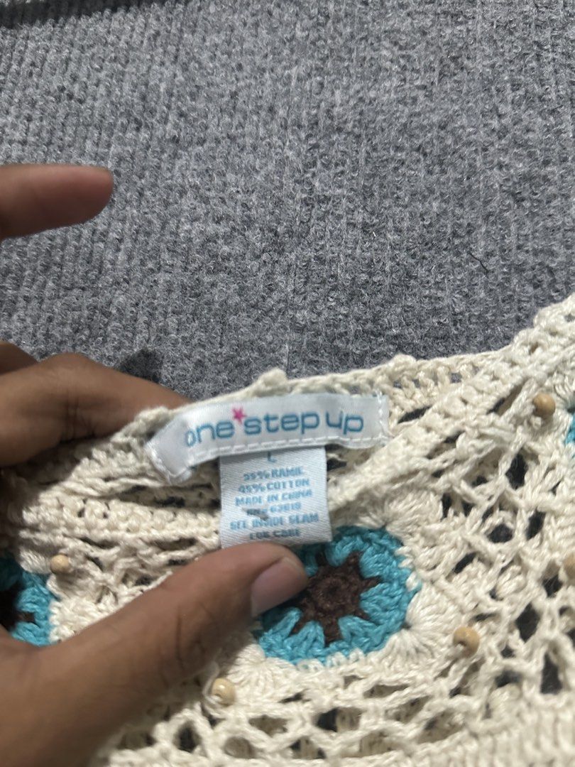 One Step Up Crochet Tank Top Size L (Category: Sleeveless) located in Villasis. Submitted by justinramosonfb (Listing ID 1464711902, Image 3). Description: - Brand: One Step Up - Size: L - Material: 55% ramie, 45% cotton - Color: Cream with turquoise and brown floral crochet accents - Details: Cute wooden beads near neckline - Fit: Lightweight, breezy, and great for layering in warm weather.