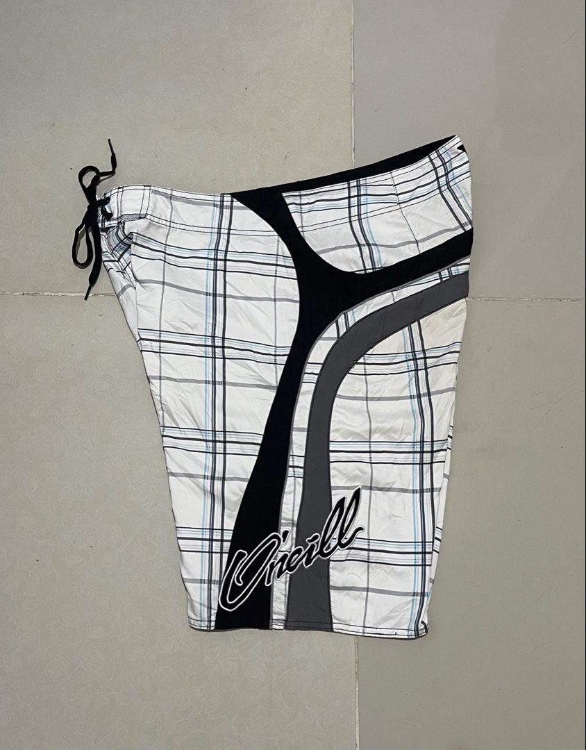 O'Neill Plaid Board Shorts Size 38 (Category: Swim Trunks & Board Shorts) located in Manila. Submitted by micoletszx81430 (Listing ID 1464700527, Image 2). Description: - Brand: O'Neill - Design: White, black, and blue plaid with black side panels and grey piping - Features: Signature O'Neill logo on leg and waistband, secure drawstring closure - Size: 38 (Waist) x 22 (Length) - Condition: Excellent, ready to wear.
