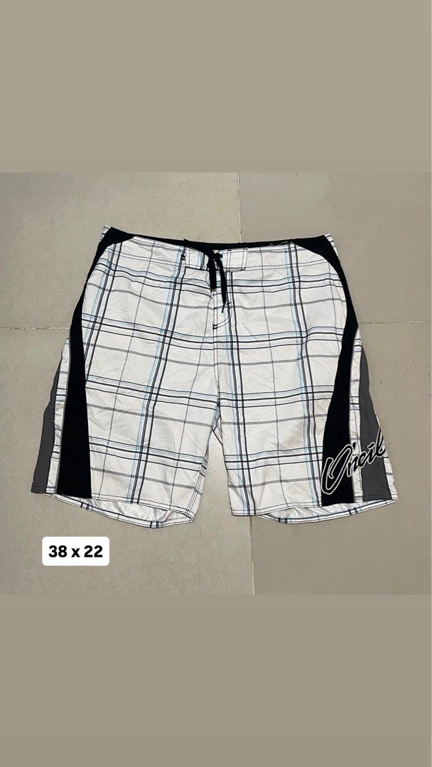 O'Neill Plaid Board Shorts Size 38 (Category: Swim Trunks & Board Shorts) located in Manila. Submitted by micoletszx81430 (Listing ID 1464700527, Image 1). Description: - Brand: O'Neill - Design: White, black, and blue plaid with black side panels and grey piping - Features: Signature O'Neill logo on leg and waistband, secure drawstring closure - Size: 38 (Waist) x 22 (Length) - Condition: Excellent, ready to wear.