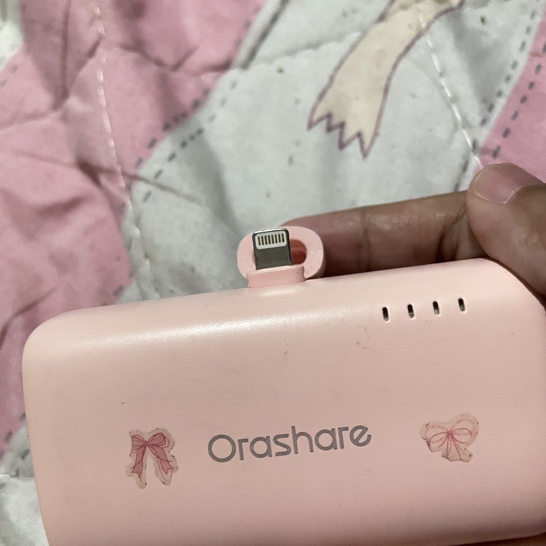 Orashare Pink Portable Charger (IOS ONLY) (Category: Chargers & Cables) located in Cainta. Submitted by hayiyimaw (Listing ID 1463438229, Image 2). Description: - Adorable pink Orashare portable charger - Battery level indicator lights for easy monitoring - Compact and travel-friendly - Ideal for charging your devices anywhere, anytime - No issue - For ios only - 10000mah ₱500 fixed Location, Cainta Rizal.