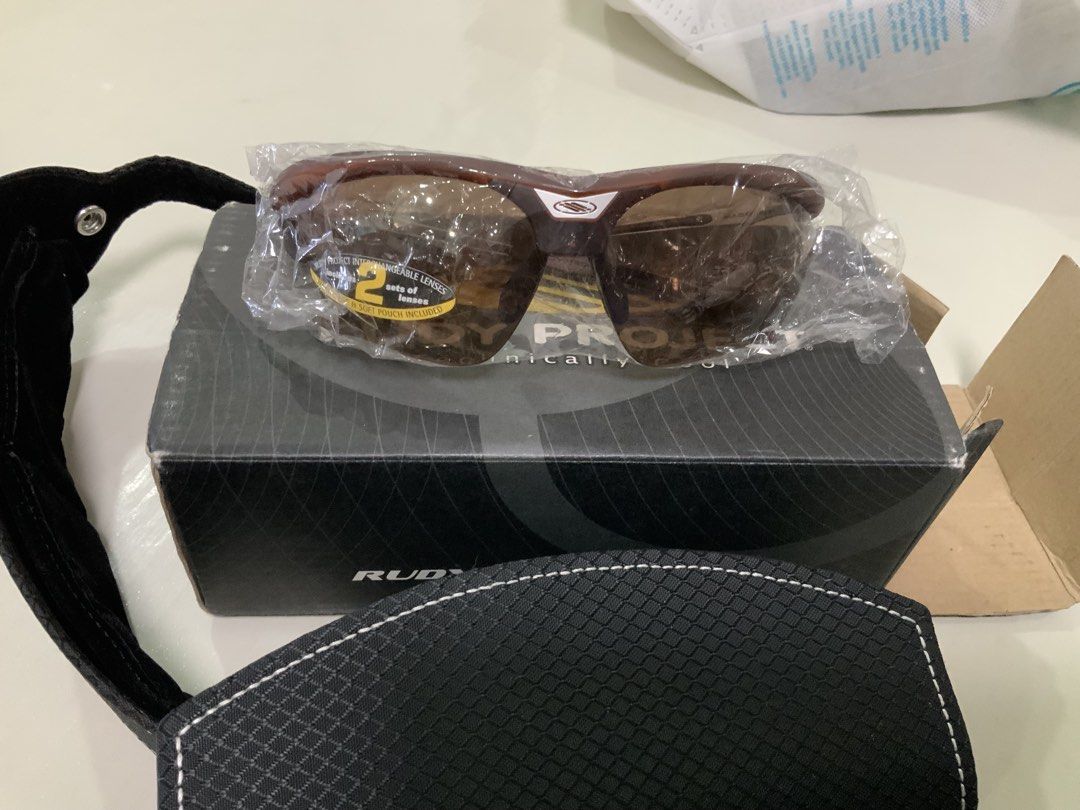Original Rudy Project Sunglasses with Extra Lenses and Case (Category: Sunglasses & Eyewear) located in San Fernando. Submitted by destinydeals04 (Listing ID 1464571902, Image 1). Description: - Rudy Project Sunglasses - Includes original box and protective case - Comes with two sets of lenses - Ideal for sports and outdoor activities - Features a technically cool design Still can negotiate.