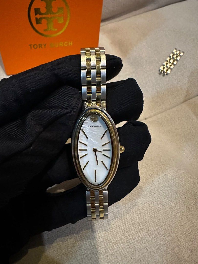 Original Tory Burch Oval Watch (Category: Women's Watches) located in Cavite. Submitted by rubieanne__ (Listing ID 1464588682, Image 1). Description: riginal tory burch two tone oval watch excellent brand new condition complete links and inclusions ₱27,800 srp selling low ₱4,500 pawnable moneyback guranteed.