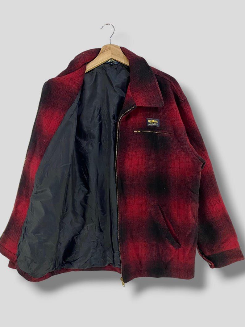 OshKosh B'gosh Red Plaid Zip-Up Jacket (Category: Coats, Jackets and Outerwear) located in General Santos City (Dadiangas). Submitted by thiftnibadi3 (Listing ID 1464642543, Image 3). Description: - Classic red and black plaid OshKosh B'gosh jacket - Zip-up front with a collar - Two side pockets and one small zippered chest pocket - Lined interior for extra warmth - Durable and perfect for layering.
